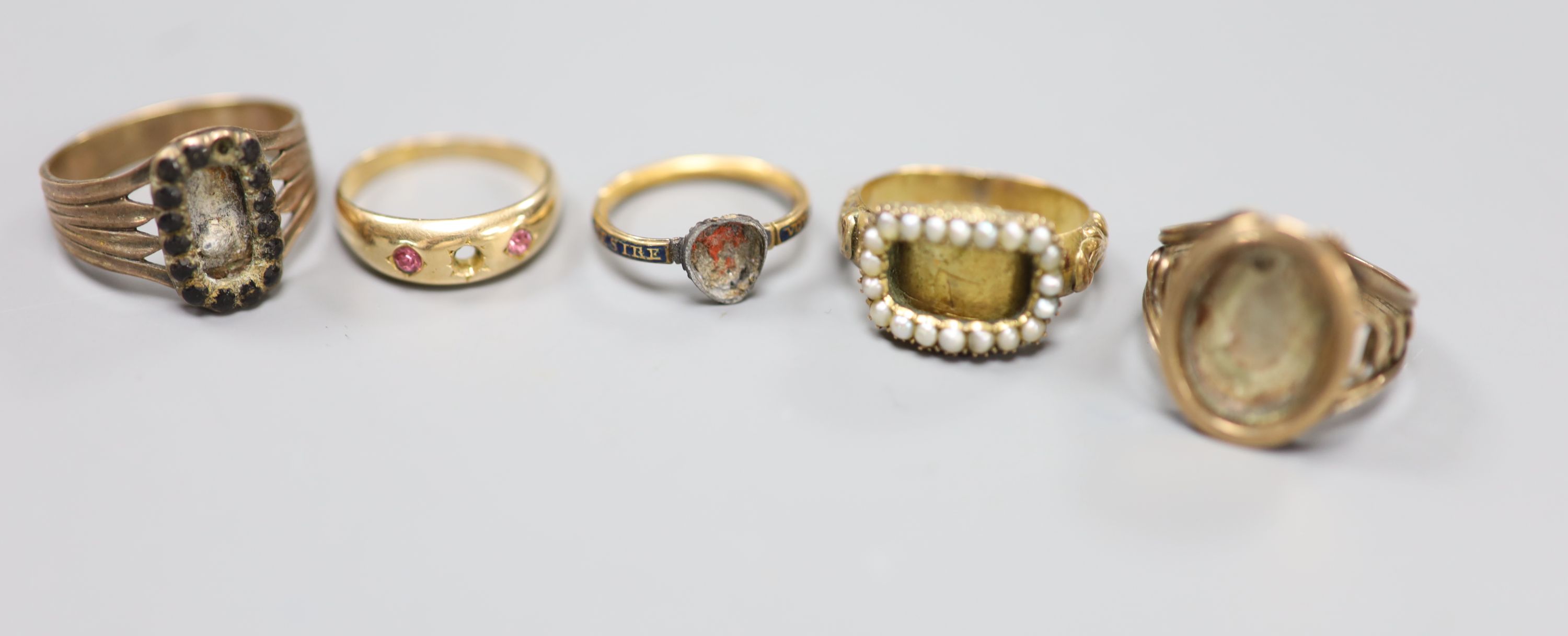 A 15ct and gem set ring 9a.f.) gross 2.3 grams and four other 19th century yellow metal rings(a.f.)